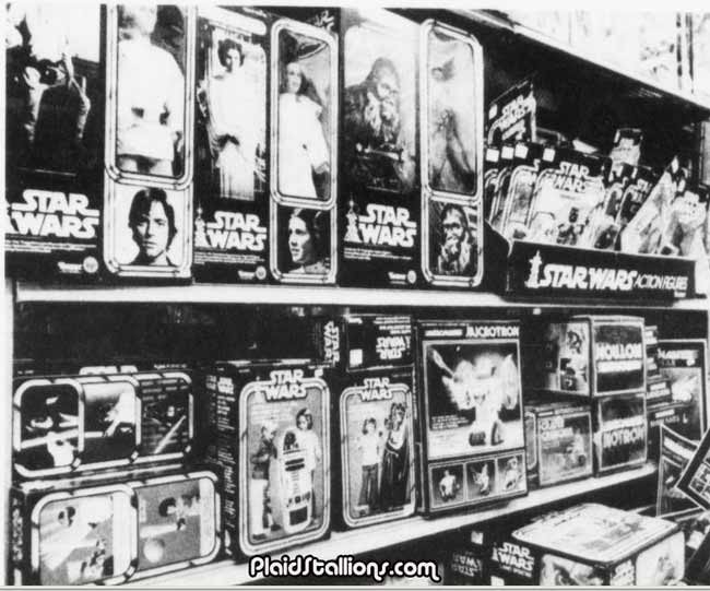 a rack of vintage star wars action figures